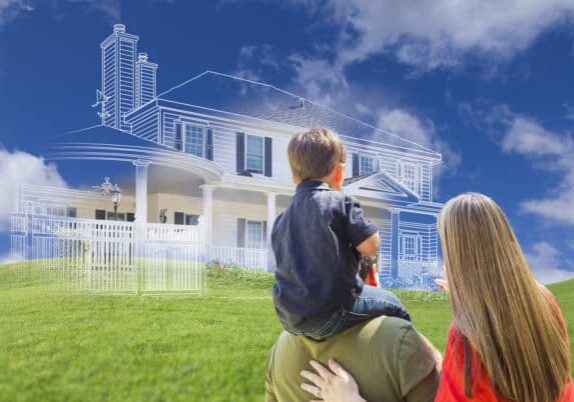 Young Family Facing Ghosted House Drawing, Partial Photo and Rolling Green Hills.